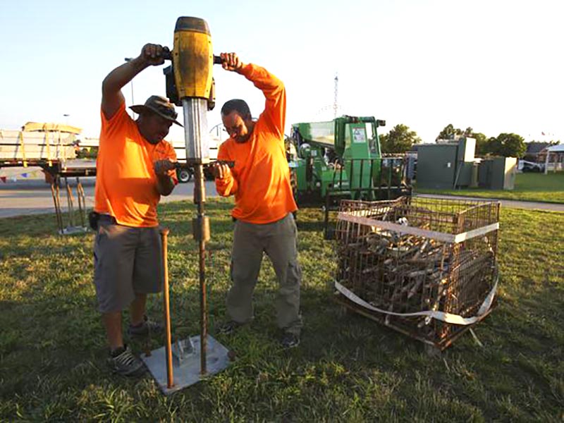 Men helping to put together a tent from our tent manufacturers.