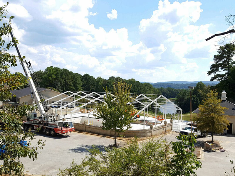 Aerial view tent manufacturers setting up for an event.